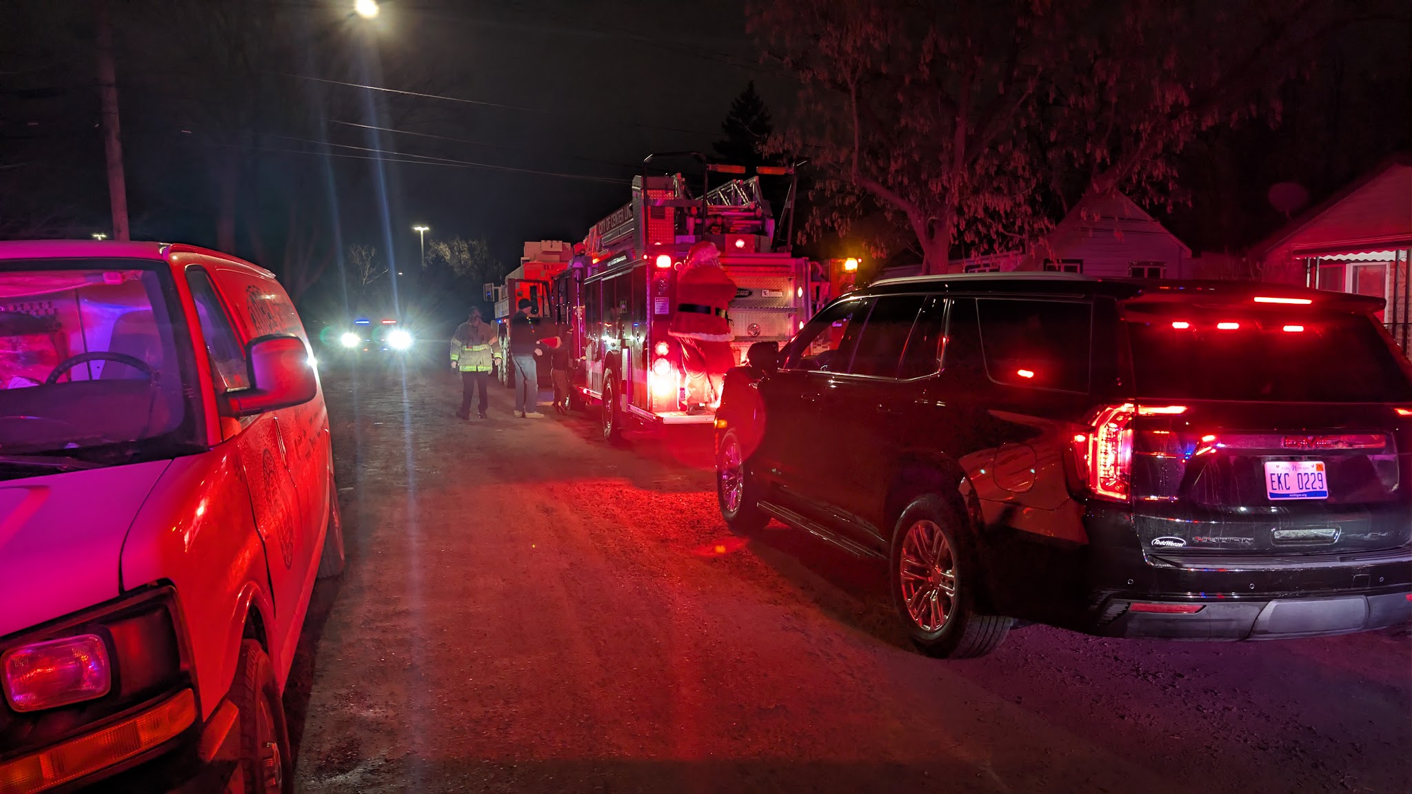 The convoy stopped on a Center Line street at night